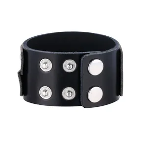 Punk style black leather cuff bracelet for men and women, cool rivet metal snap jewelry accessory.