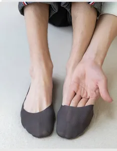 Detail view of men's breathable invisible boat socks in dark grey, featuring shallow mouth design.