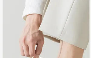 Close-up detail shot of men's casual shorts and apparel showcasing fine fabric and stitching quality.