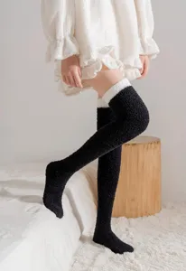 Cozy plush over-the-knee winter socks, thick warm coral fleece long socks for women.