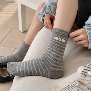 Women's wool striped mid-tube socks with cute egg cloth label, cozy winter casual knit socks.