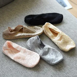 Close-up detail of women lace boat socks showing delicate floral patterns and breathable fabric.