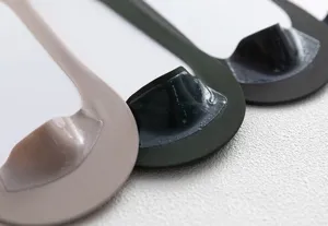 Close-up detail of mens low cut invisible socks featuring anti-slip silicone heel grip.