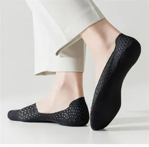 Close-up detail of breathable black mesh low cut boat socks with anti slip cotton bottom.