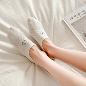 Detailed view of women's cute puppy embroidered low cut hidden boat socks, soft cotton fabric.