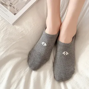 Detail shot of grey cotton boat socks for women featuring cute puppy embroidery, soft and comfortable.