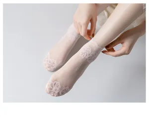 Detailed view of women's sheer lace short socks featuring delicate floral mesh for summer.
