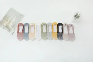 Detail shot of women lace boat socks showing various color options and delicate floral lace mesh design.