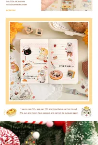 Detail of cute cat themed PET stickers applied to notebook pages for creative journaling