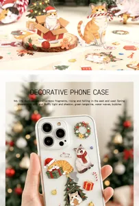 Detailed view of festive Christmas cat stickers applied to a transparent phone case