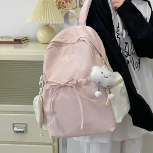 Pink casual school backpack for women, lightweight large capacity student travel bookbag.
