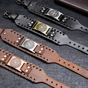 Mens wide leather bracelet with vintage metal plate and nordic viking rune design.