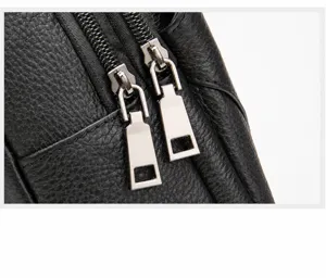 Men's leather chest bag metal zipper detail view, smooth and durable alloy hardware display.