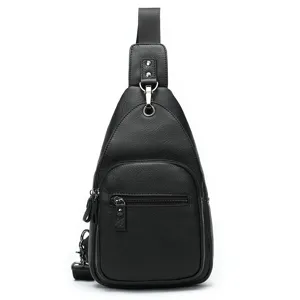 Close-up detail of the black leather chest bag showing the durable metal zipper and buckle.