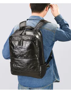 Men's black leather backpack with hand-grained texture, large capacity for daily commute.