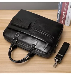 Primer plano de un elegante maletín de negocios negro de cuero con asa y correa ajustable.