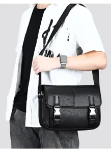 Detail shot of men genuine leather messenger bag, showing texture, buckle and strap.