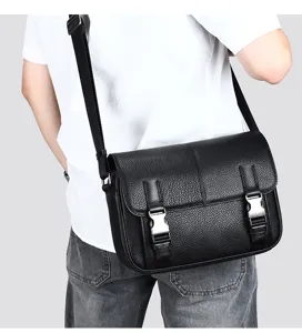 Men leather crossbody bag detailed view showing premium black texture and buckles.