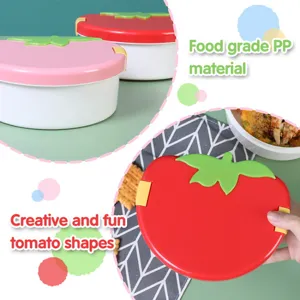 Gedetailleerd uitzicht op de creatieve tomatenvormige kinderbento-box van PP-materiaal.