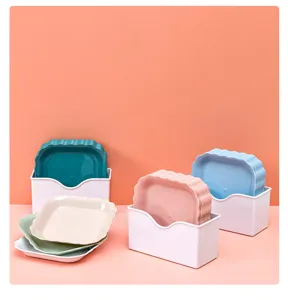 Plastic bone disposal plate set with storage box, wavy edge snack dish for kitchen use.