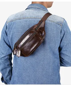 Detail shot of retro leather chest bag, showing multi-zipper pockets and cowhide texture.