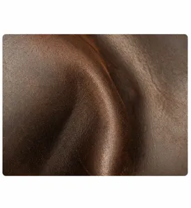 Premium genuine leather detail showing natural texture, durable and soft touch for travel bags.