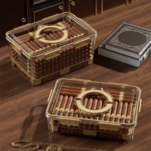 Transparent acrylic cigar humidor storage box with gold locks and large capacity humidifying set.
