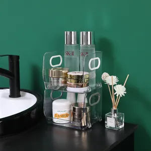 Transparante stapelbare cosmetische opbergdoos van kunststof voor bureau make-up verzorging.