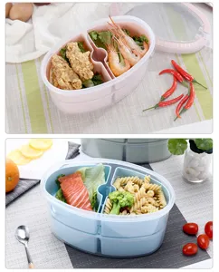 Portatile scatola per bento da pranzo ovale in plastica a doppio strato con scomparti per cibo.