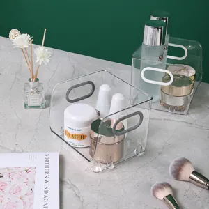 Transparante cosmetische opbergdoos met handvat, stapelbare make-up organizer voor op het bureau.