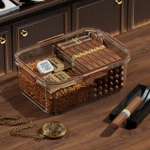 Boîte humidor à cigares en acrylique transparent avec hygromètre, copeaux de bois de cèdre et design étanche.