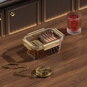 Boîte humidor à cigares en acrylique transparent avec copeaux de bois de cèdre et humidité.