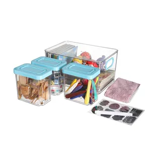 Clear desktop storage box detail showing stackable design and secure buckle closure.