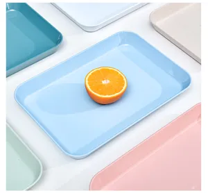 Detailed view of colorful plastic storage trays, multi-purpose kitchen serving plates display.