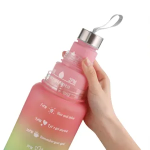 Gradient frosted outdoor sports water bottle with inspiring time markers and strap.