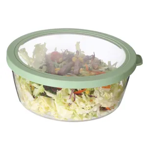 Clear PET round food storage container with green lid, ideal for kitchen refrigerator use.