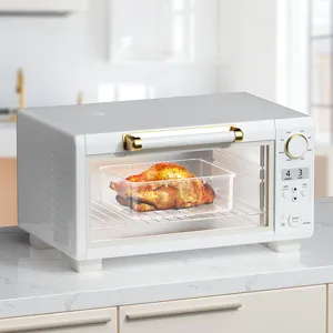 Modern white electric toaster oven with gold handle and digital control panel for kitchen use.