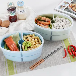 Contenitore per alimenti bento ovale a doppio strato con scomparti in plastica PP.