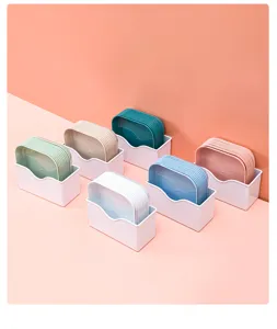 Detail shot of colorful square plastic trays with white storage holders for home snacking.