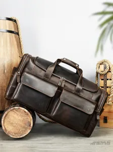 Detailed view of the vintage crazy horse leather travel duffel bag with multiple pockets.