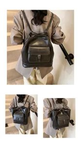 Vista dettagliata dello zaino in pelle grigio scuro vintage elegante con tasca e fibbia.