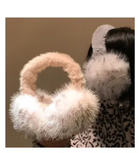 Fluffy winter earmuffs for women, warm plush ear warmers, cozy cold-proof outdoor wear.