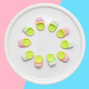 Detailed view of colorful miniature resin slippers for DIY dollhouse and phone case decoration