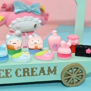 Close-up of colorful miniature resin cupcakes and dessert accessories for DIY crafts