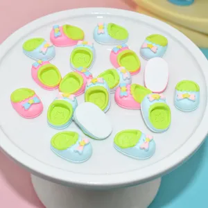 Macro detail of colorful resin miniature slippers for DIY phone case and dollhouse crafts