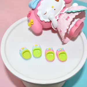 Close-up of miniature colorful resin slippers for DIY dollhouse and phone case decoration