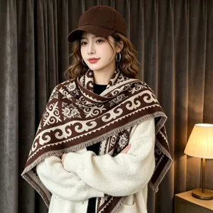 Detailed shot of a women's jacquard warm shawl scarf in brown retro pattern with fringe.