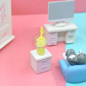 Detailed macro view of a miniature yellow lemon drink cup in a cute dollhouse scene