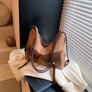 Retro suede motorcycle style women backpack versatile large capacity casual commuting bag.