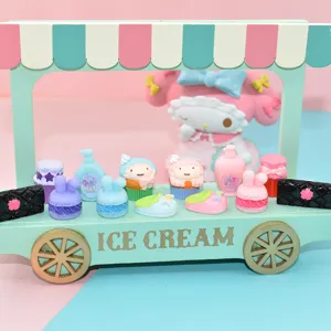 Macro view of miniature resin cupcakes and macarons for DIY crafts and dollhouses